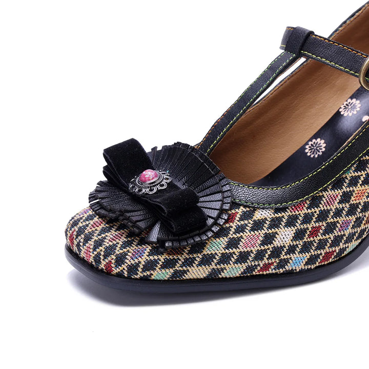 Plaid pump with black bow applique and small floral motifs on the upper