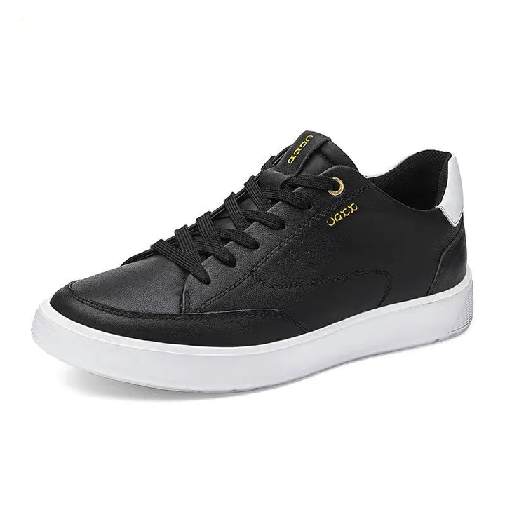 Black sneaker with white sole on a white background, featuring the brand &