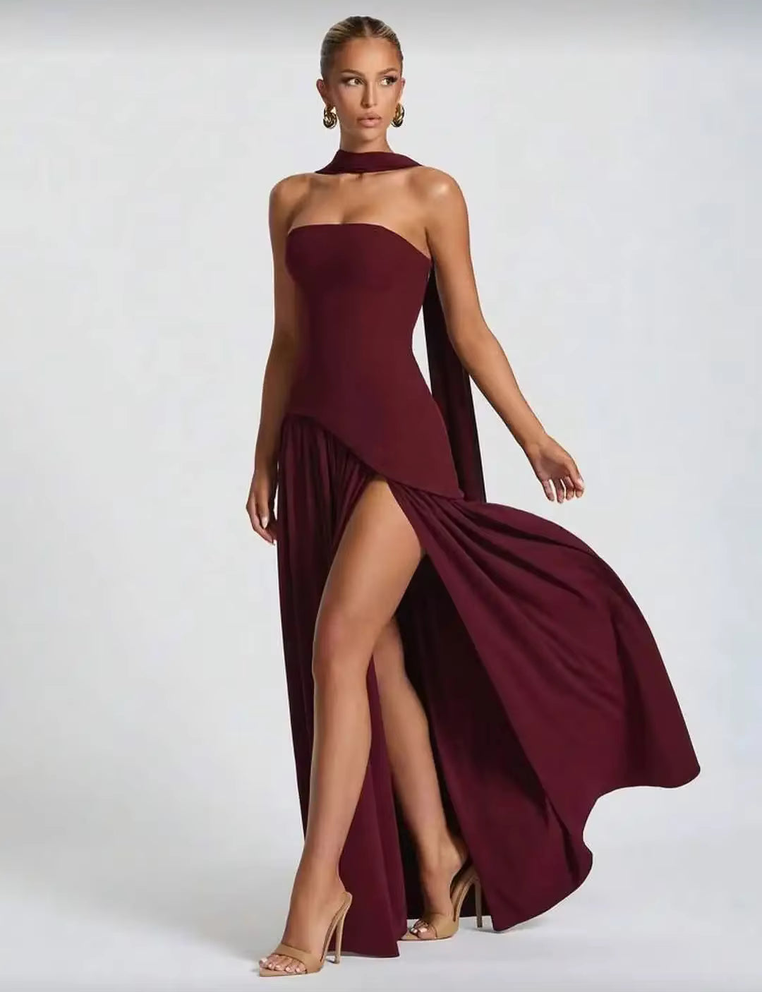 Burgundy strapless long dress with high thigh slit and draped waist