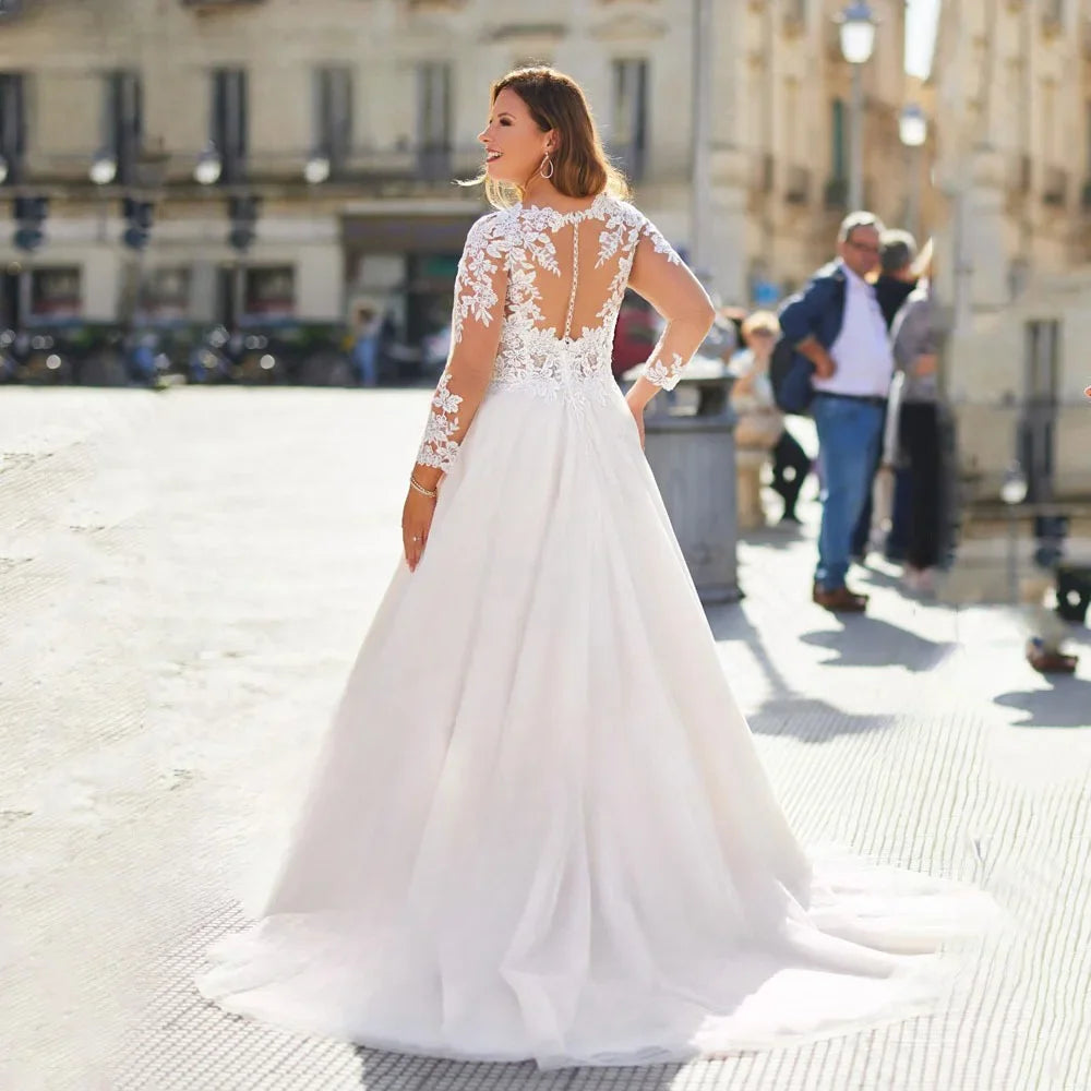 Sheer lace O-neck bridal gown with open back, long sleeves, and full skirt