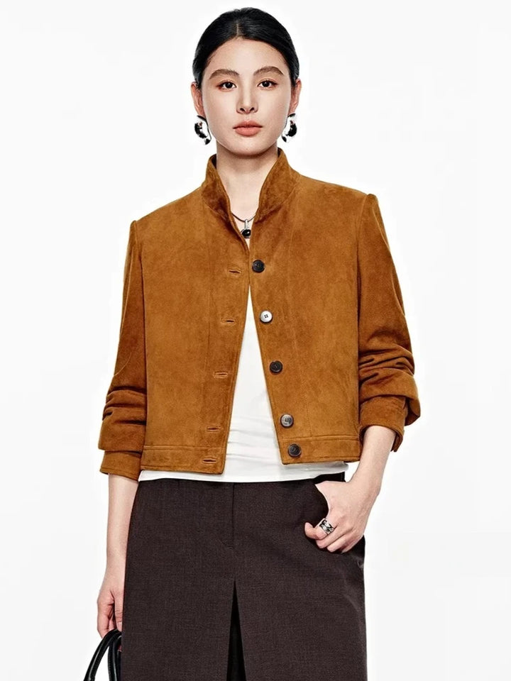 Brown suede cropped jacket with snap buttons and stand collar, long sleeves.
