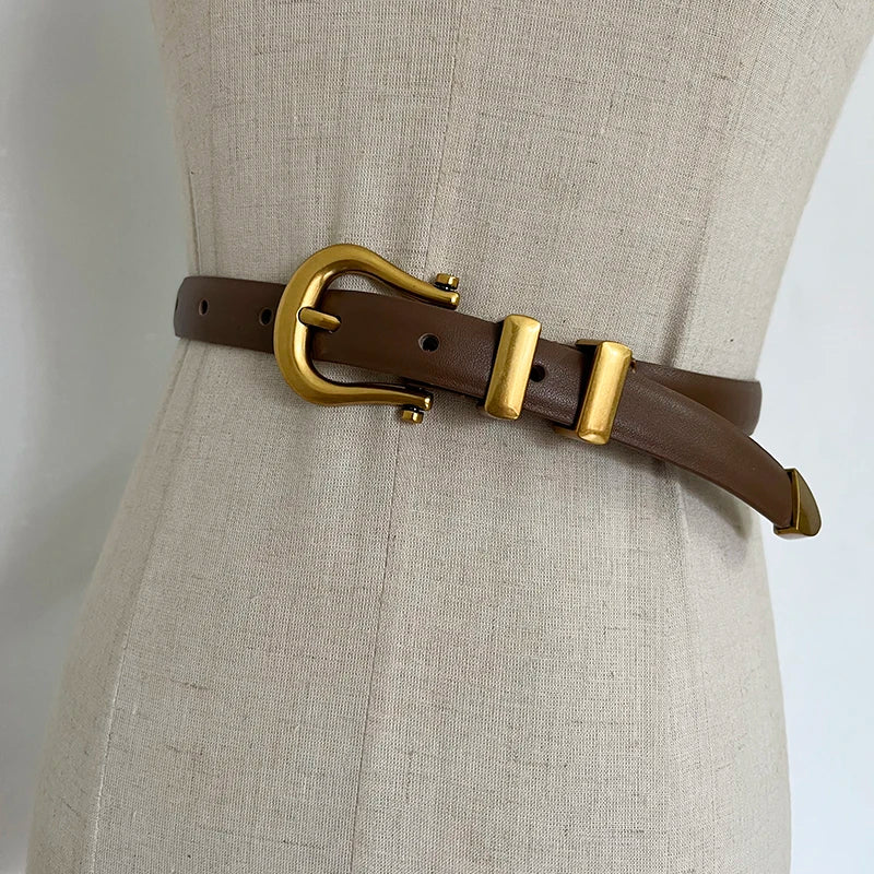 Brown narrow leather corset belt with gold-tone oval buckle and two rectangular tabs