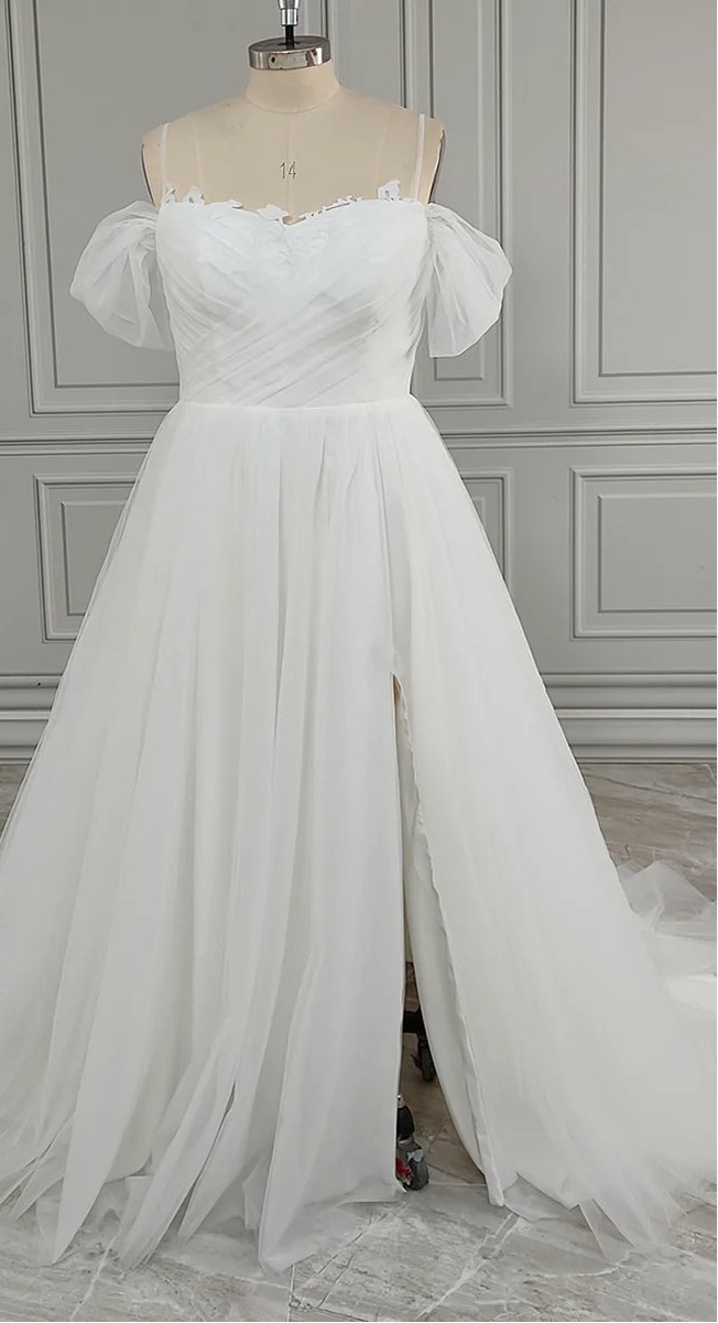 White A-line tulle bridal gown with sweetheart neckline, off-shoulder puff sleeves, front slit