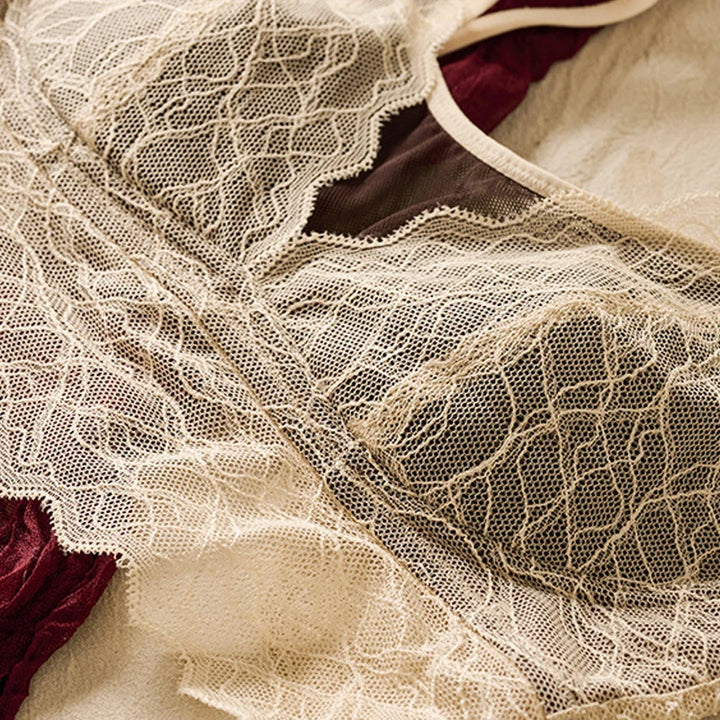 White lace cup close-up with scalloped edge and sheer mesh overlay
