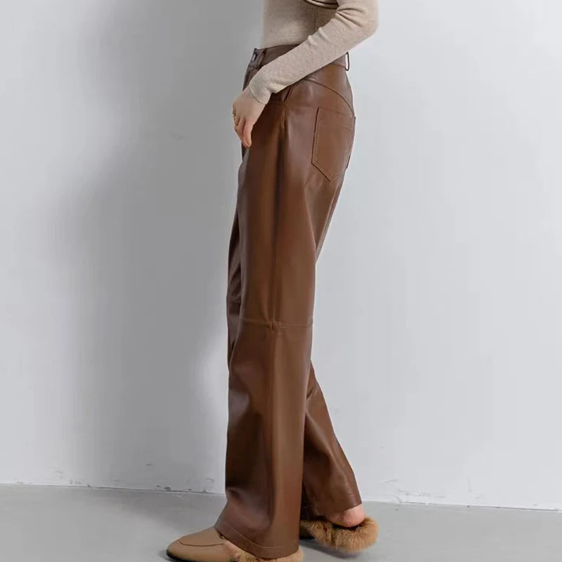 Brown leather straight-leg pants with side seams and flared ankle hem