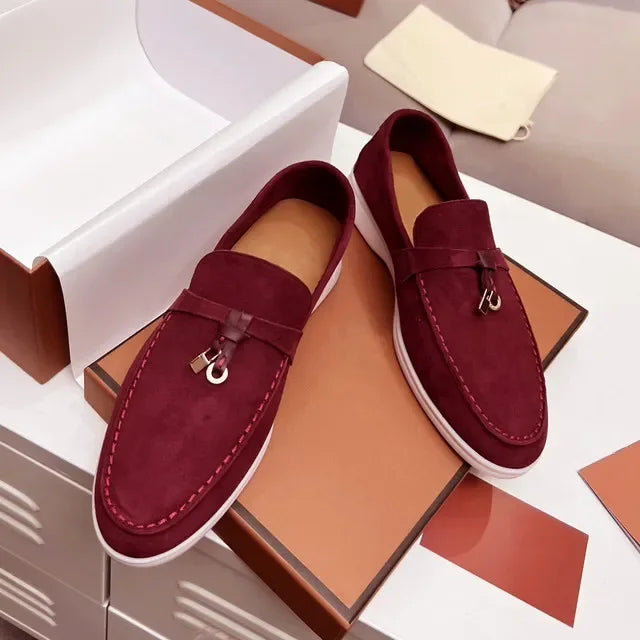 Burgundy suede slip-on loafers with metal bit detail and white rubber sole