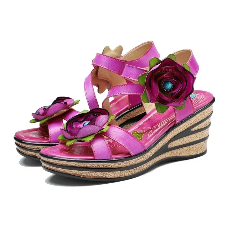 Pink leather wedge sandals with large rose applique and cutout straps