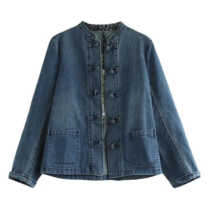Blue denim jacket with loose fit, button front, stand collar, and chest pockets