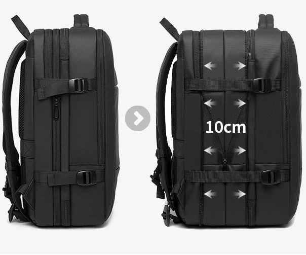 Black backpack front view with adjustable shoulder straps and buckled compression panel