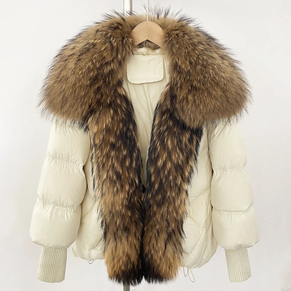 Cream puffer coat with oversized brown faux-fur collar and front zip, rib-knit cuffs