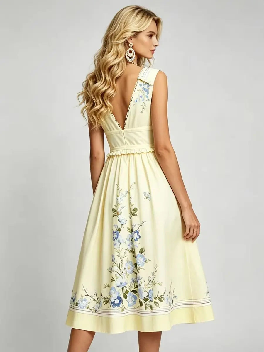Light yellow floral midi dress seen from side, V-neck with ruffled trim and A-line skirt