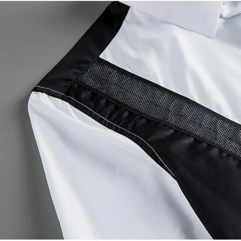 White button-up shirt with textured black mesh panel and contrast trim along shoulder