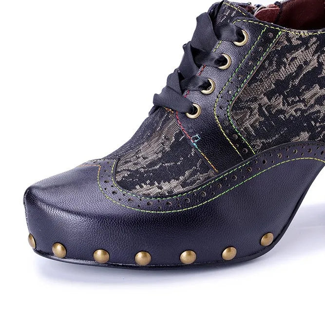 Close-up of dark printed leather lace-up heel pump with rivet-studded platform and trim