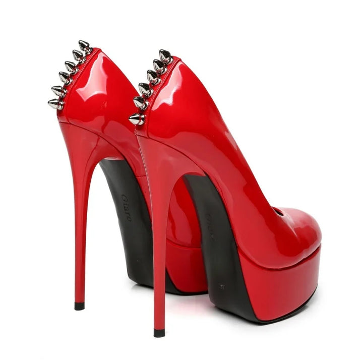 Red patent leather platform rivet heel pumps, close back view with spike rivets and stiletto heel