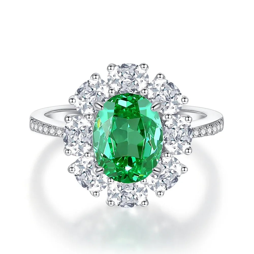 Diamond halo ring with oval green center stone and round diamond accents