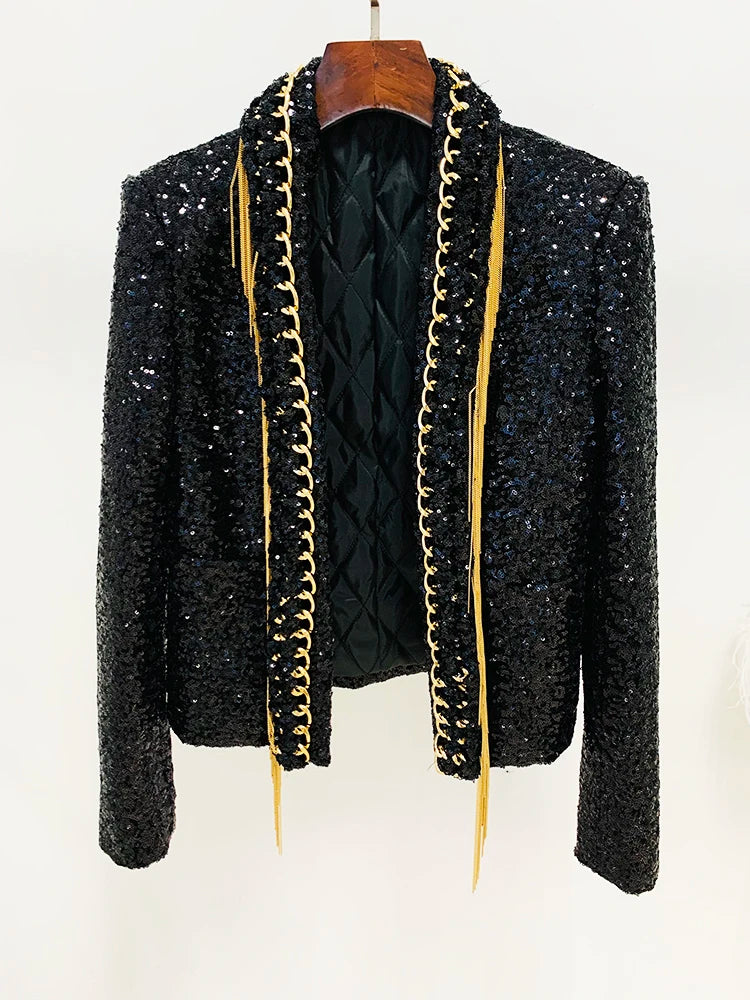 Black sequined open jacket on hanger with gold trim and long tassel fringe edges