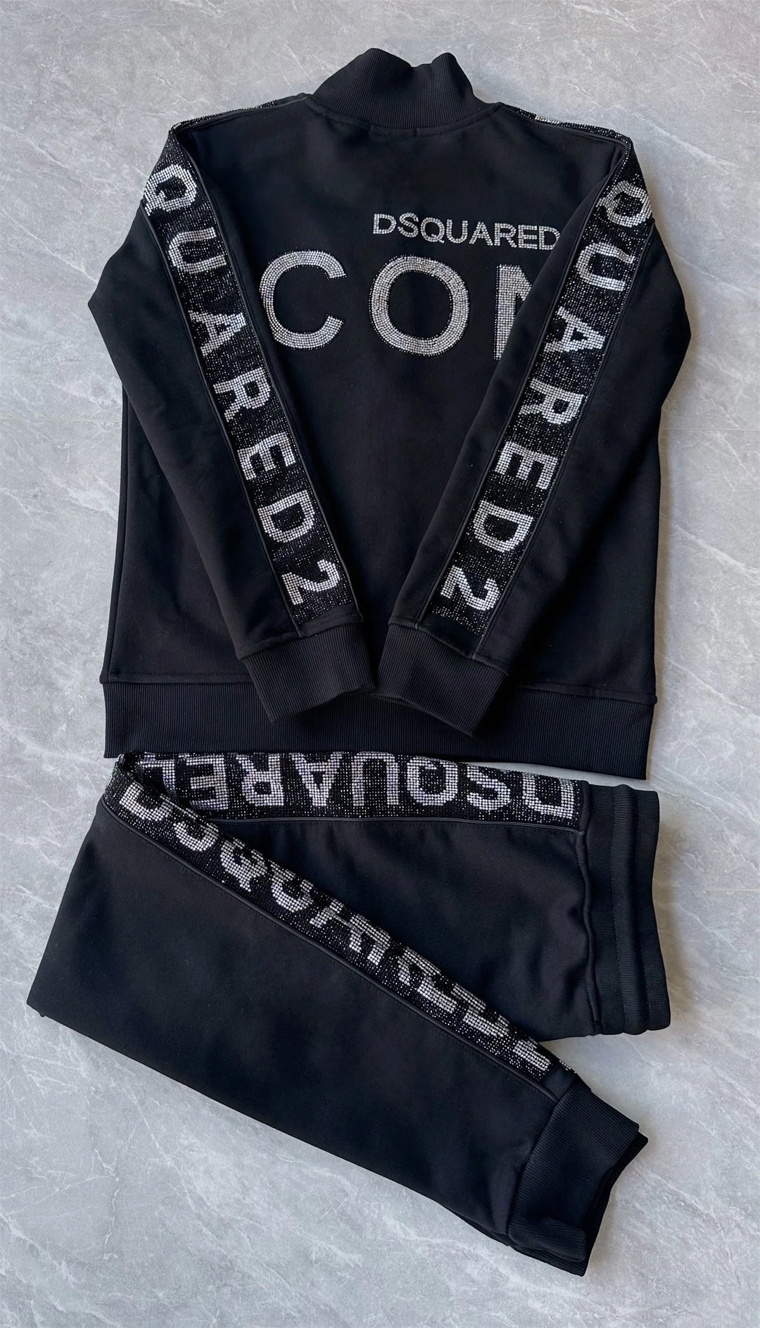Black men's two-piece tracksuit set with DSQUARED hooded jacket and matching pants