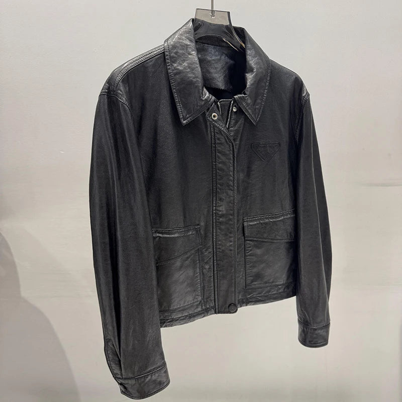 Women’s distressed leather jacket with notch lapel, front zipper, flap pockets