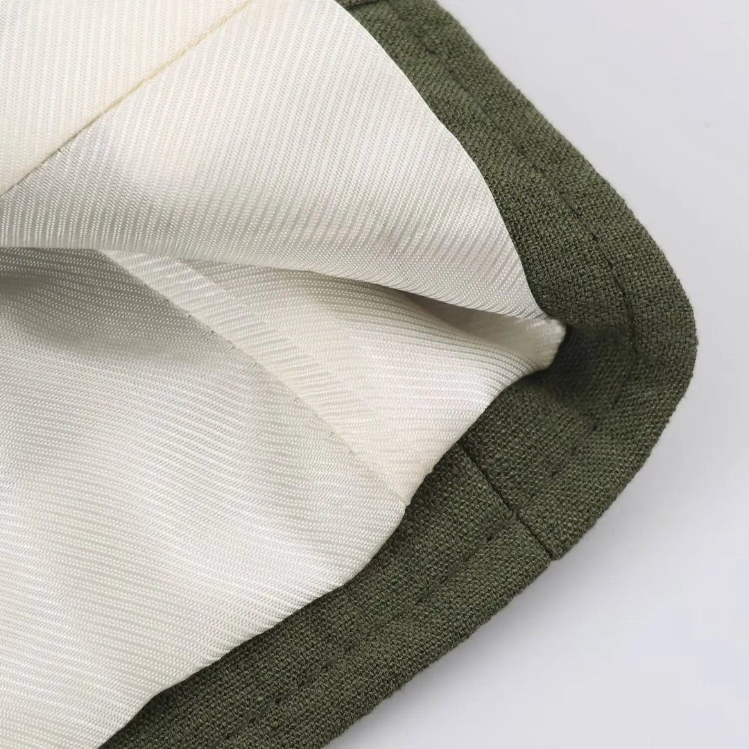Green waistcoat top lining detail at armhole, striped inner fabric