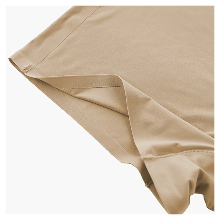 Nude ice silk fitness panties fabric close-up with bonded edge at leg opening