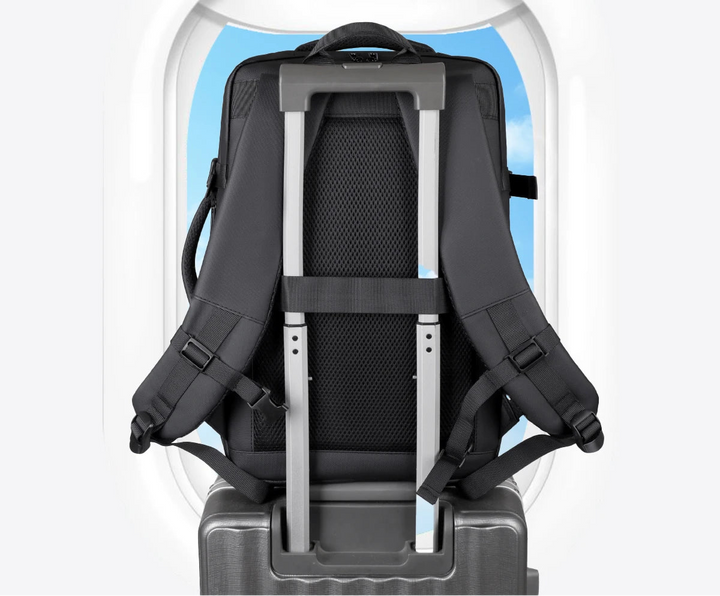 Black backpack with luggage strap on the back and padded shoulder straps