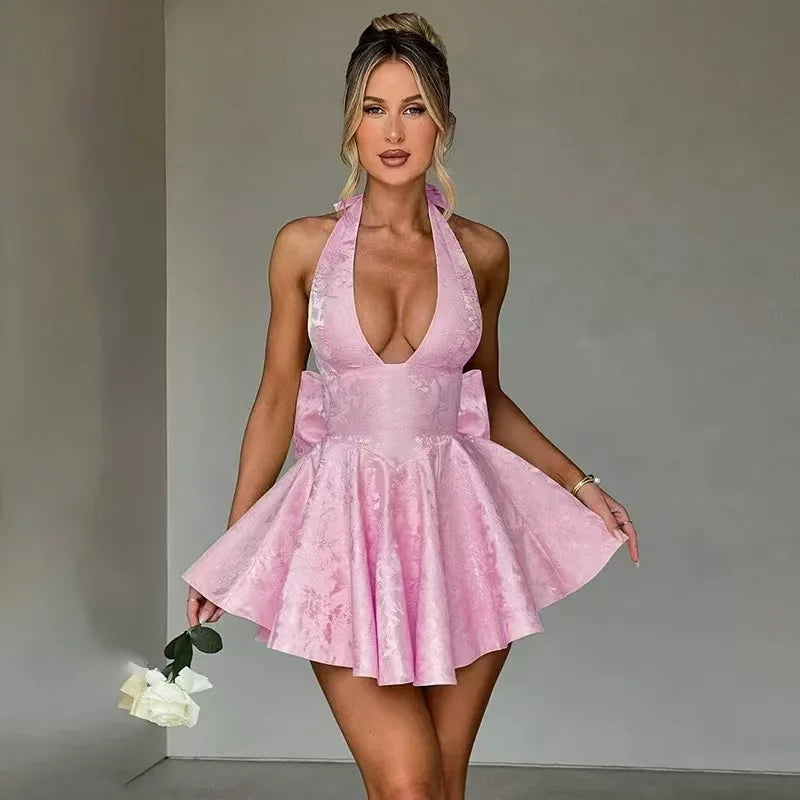 Light pink floral embroidered mini A-line dress with halter neck and flared ruffle hem