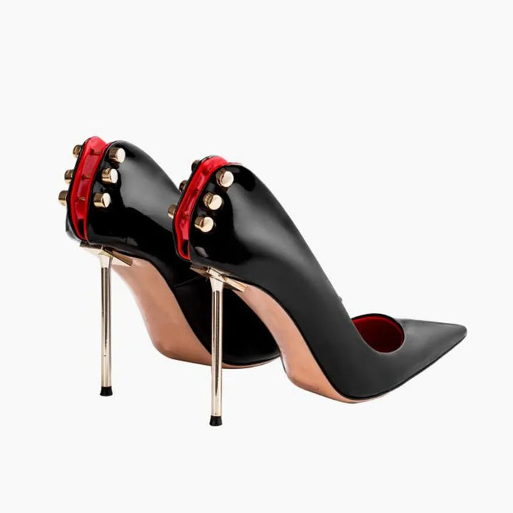 Black leather heel pumps with red ankle strap, pointed toe, gold studs, stiletto heels
