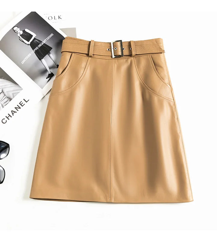 Apricate beige leather midi skirt with front vertical seam and belt buckle