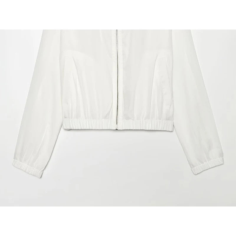White women’s zip-up jacket hem detail with elastic cuffs and gathered waistband