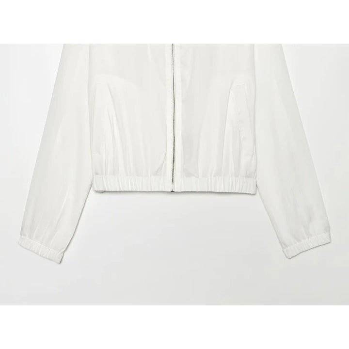 White women’s zip-up jacket hem detail with elastic cuffs and gathered waistband