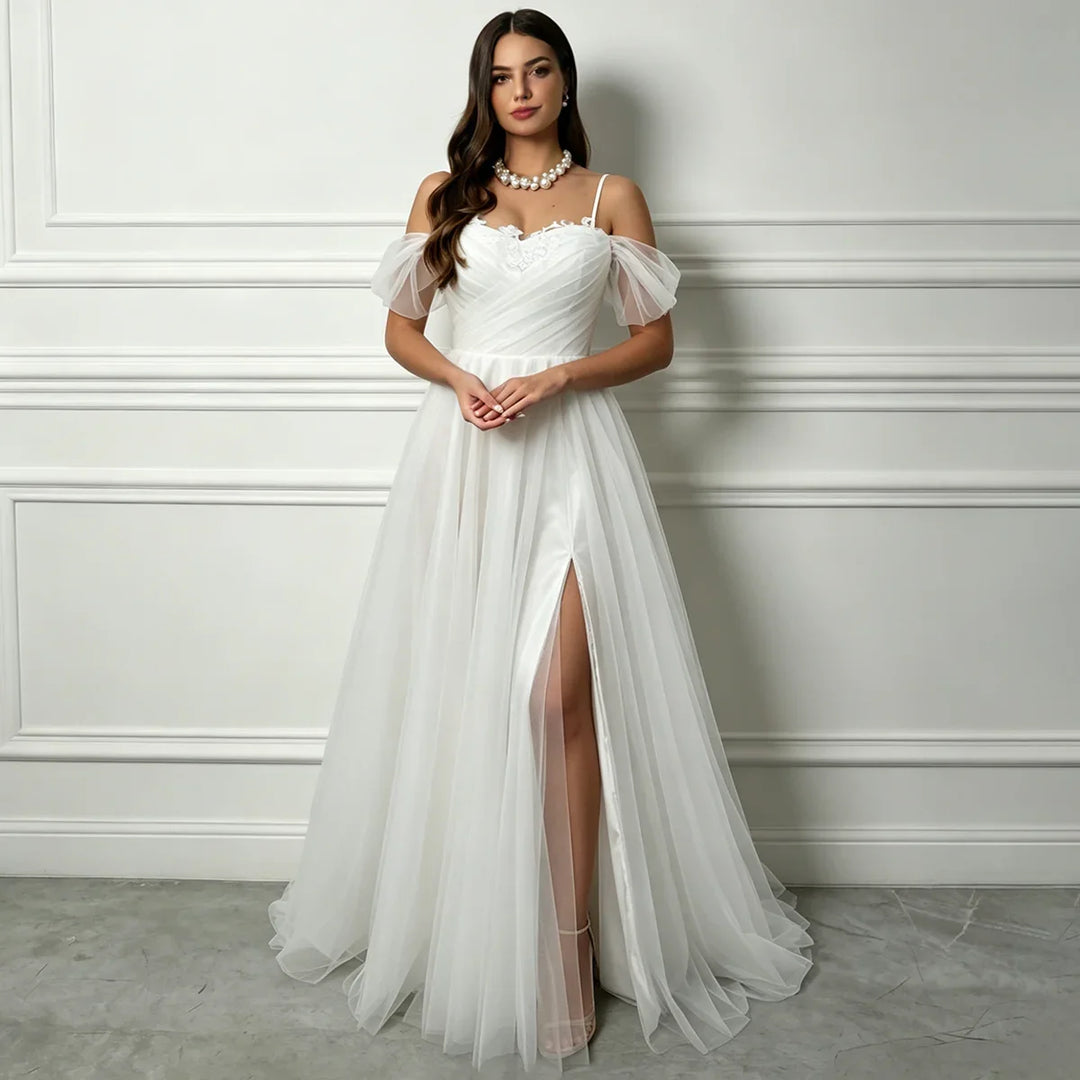 White A-line tulle bridal gown with sweetheart neckline, off-shoulder puff sleeves, front slit