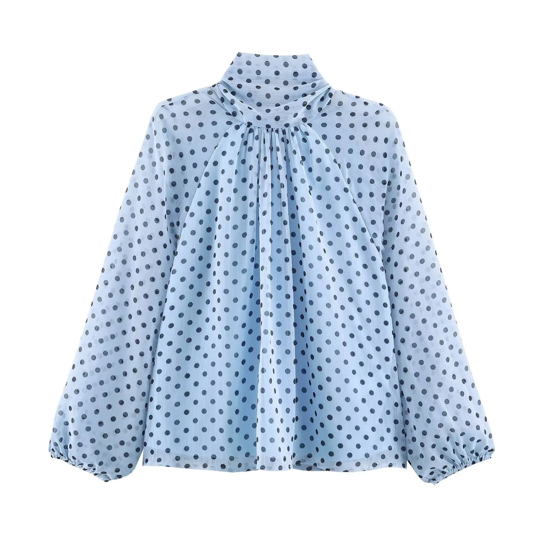 Light blue polka-dot high-neck chiffon blouse with gathered front and long puff sleeves