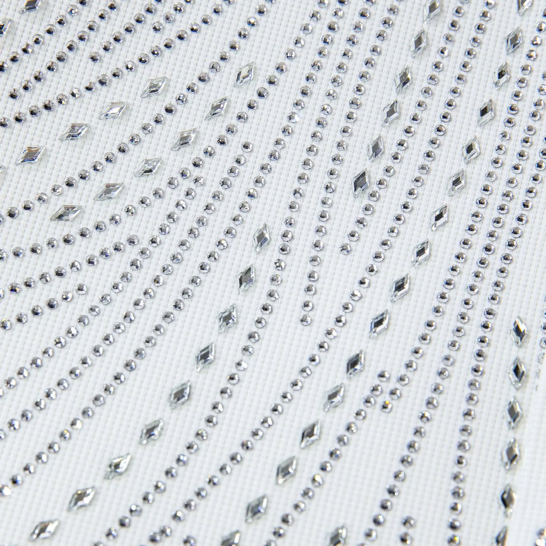 Close-up of white shirt chest with rhinestone dots and faceted stud lines