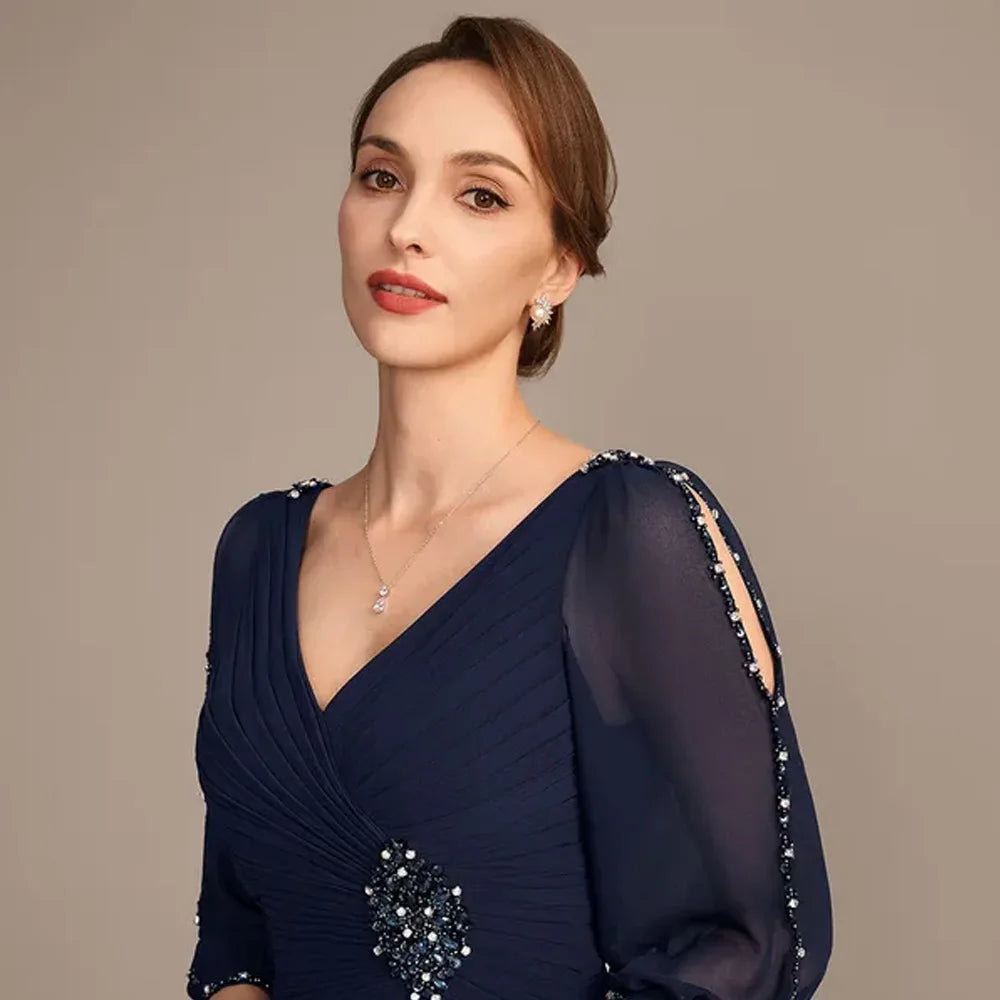 Navy chiffon V-neck gown bodice with beaded corsage detail and sheer sleeves