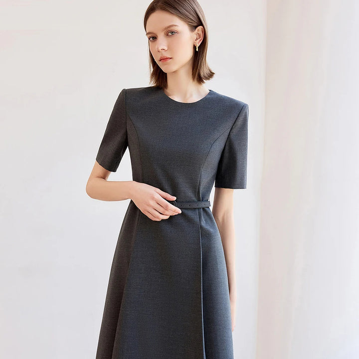 Dark grey A-line dress with belt tie and short sleeves, front three-quarter view