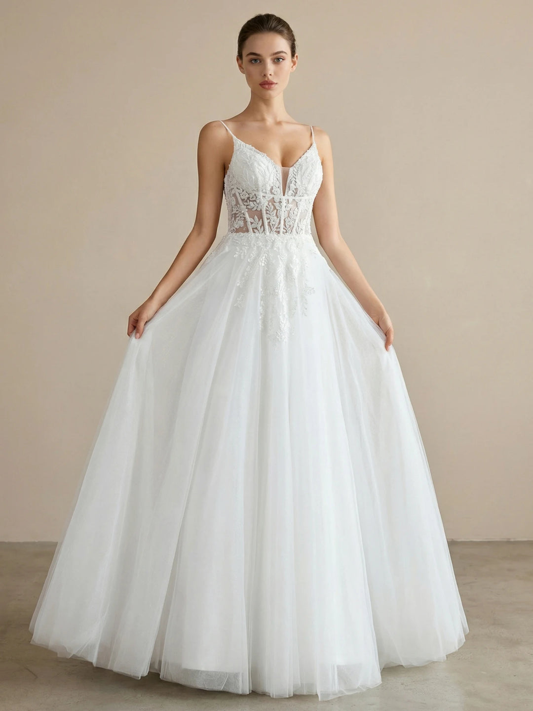 White lace tulle bridal ball gown with sweetheart neckline and fitted corset bodice