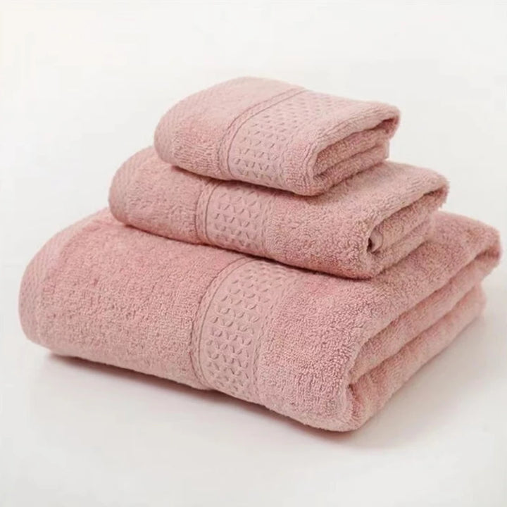 Rose-pink organic cotton towel set, 3-pc folded stack with textured patterned bands