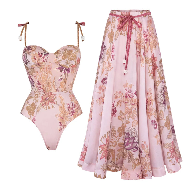Pink floral swim bodysuit with tie straps and matching pleated cover-up skirt