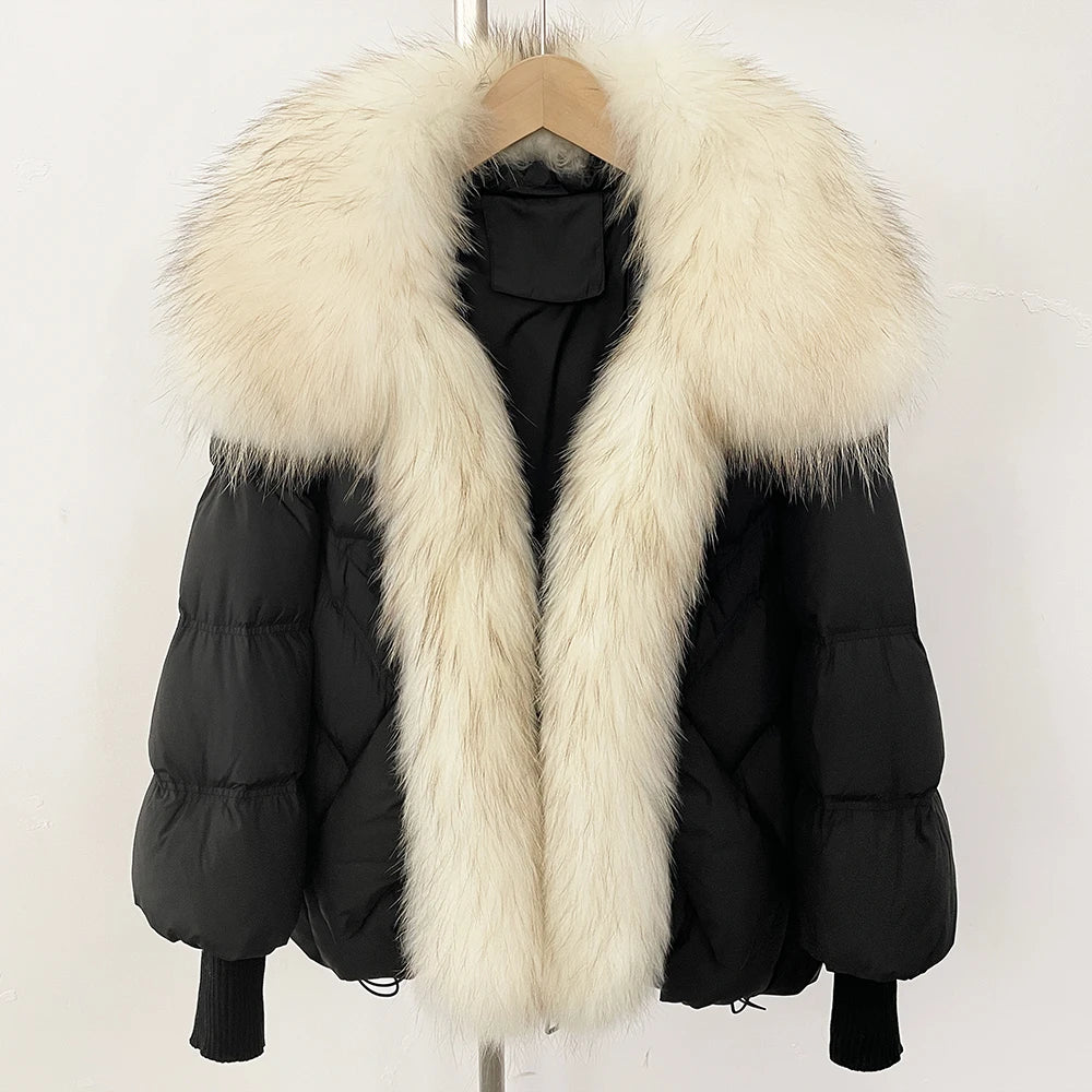 Black puffer coat with oversized white faux-fur collar and front zip, rib-knit cuffs