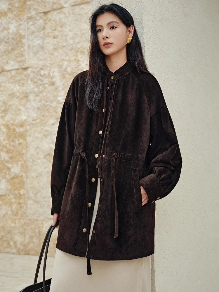 Mid-length hooded dark brown leather jacket with front pockets, gold buttons, and tie pulls