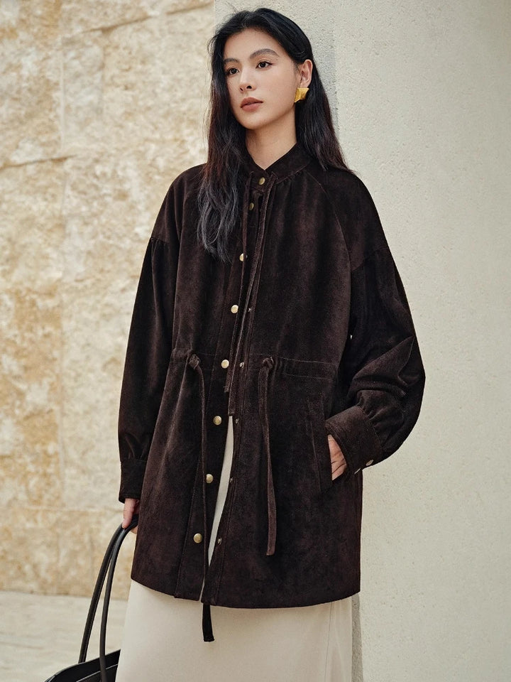 Mid-length hooded dark brown leather jacket with front pockets, gold buttons, and tie pulls