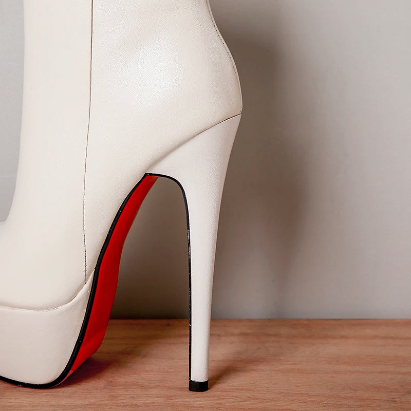 Cream leather ankle boot with high stiletto heel and red-lined interior