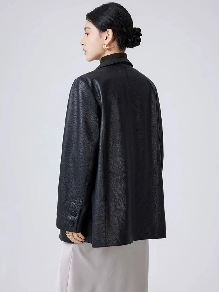 Women's black leather blazer jacket, back view with buttoned cuffs and center-back seam