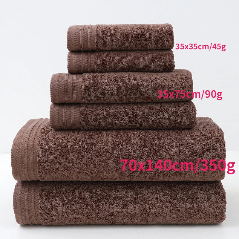 Brown cotton bath towels stacked with size labels and terry texture (6-piece set)