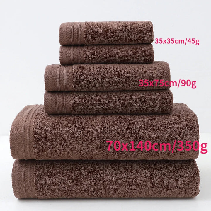 Brown cotton bath towels stacked with size labels and terry texture (6-piece set)