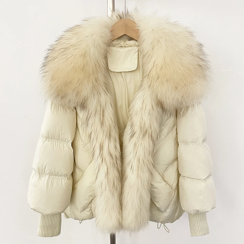 Ivory puffer coat with fluffy faux-fur hood and front trim, ribbed knit cuffs