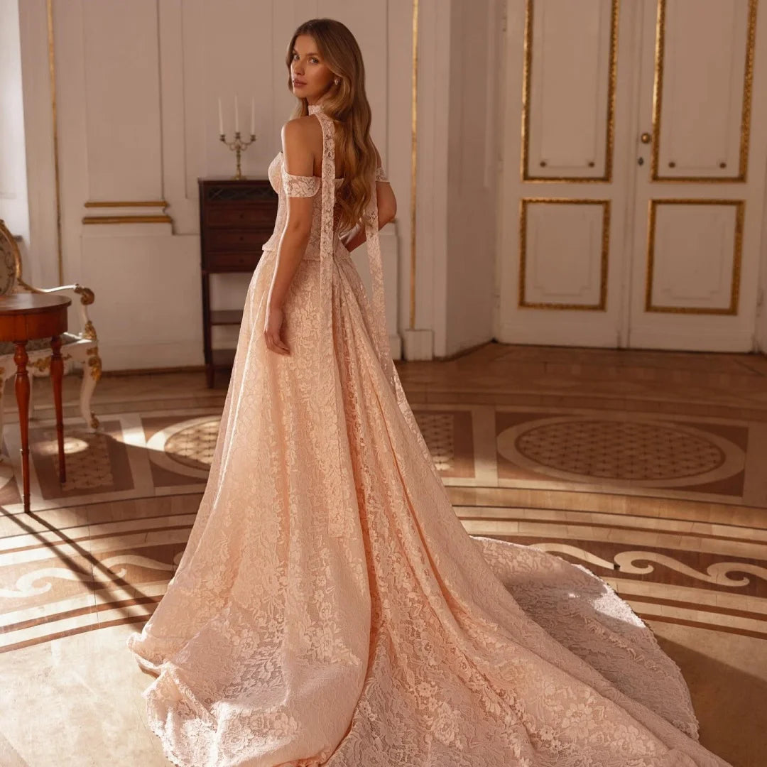 Champagne lace off-shoulder wedding gown, side view with fitted bodice and full skirt