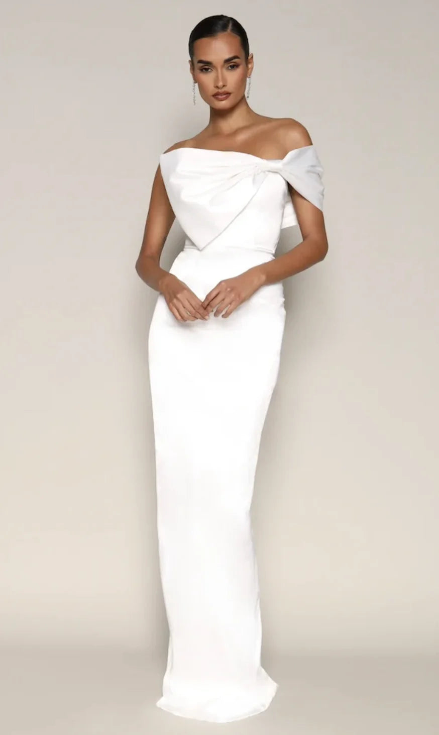 White floor-length prom gown with off-shoulder draped neckline, fitted sheath silhouette