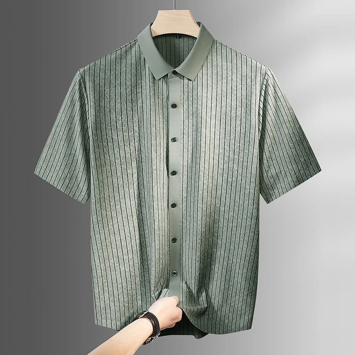 Light green striped short-sleeve button-up shirt on a wooden hanger
