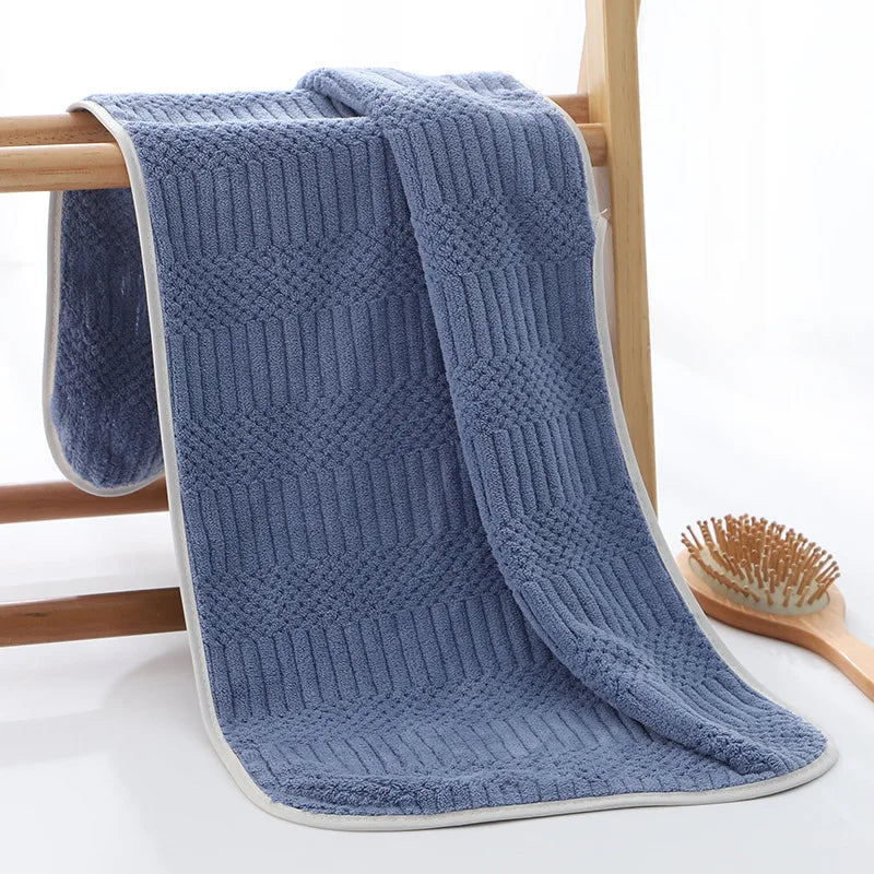 Soft microfiber towel with grid texture, dark blue folded
